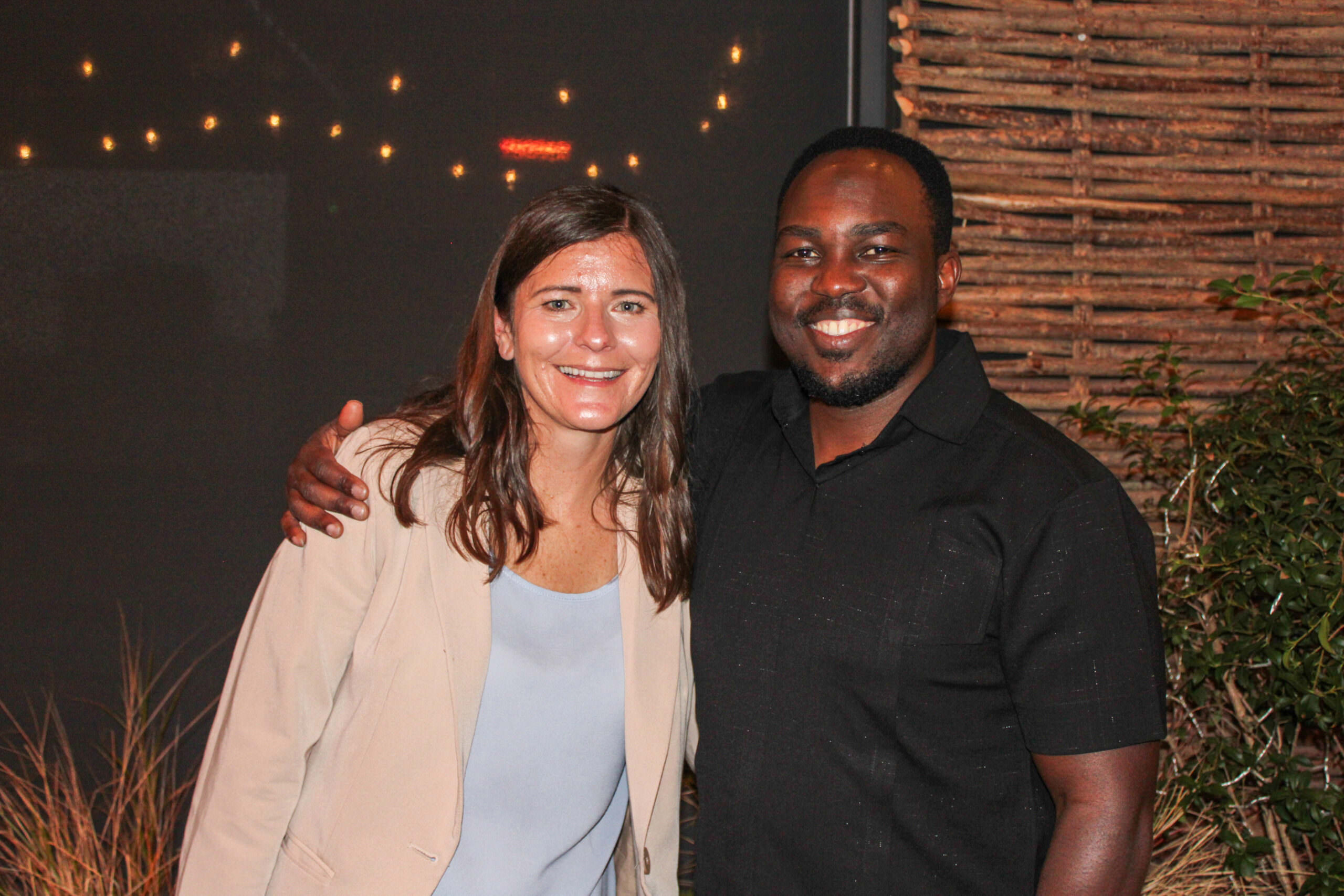 Musana founders Andrea and Haril Kazindra smiling together at the Aid v Enterprise event at The Conduit in London, May 2025.